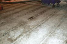 Floor prepared using vacuum shot blasting